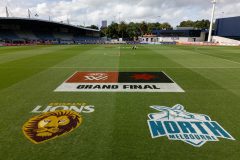 MELBOURNE, AUSTRALIA - DECEMBER 03: Grass signage is seen before the 2023 AFLW Grand Final match between The North Melbourne Tasmanian Kangaroos and The Brisbane Lions at IKON Park on December 03, 2023 in Melbourne, Australia. (Photo by Dylan Burns/AFL Photos)