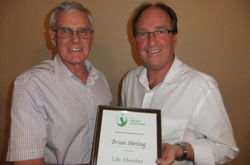 Life Member Brian Stirling accepts his award